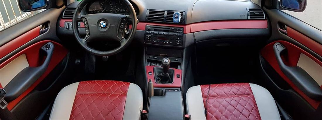 Interior de BMW Seria 3 refăcut complet, cu piele roșie matlasată și inserții vopsite